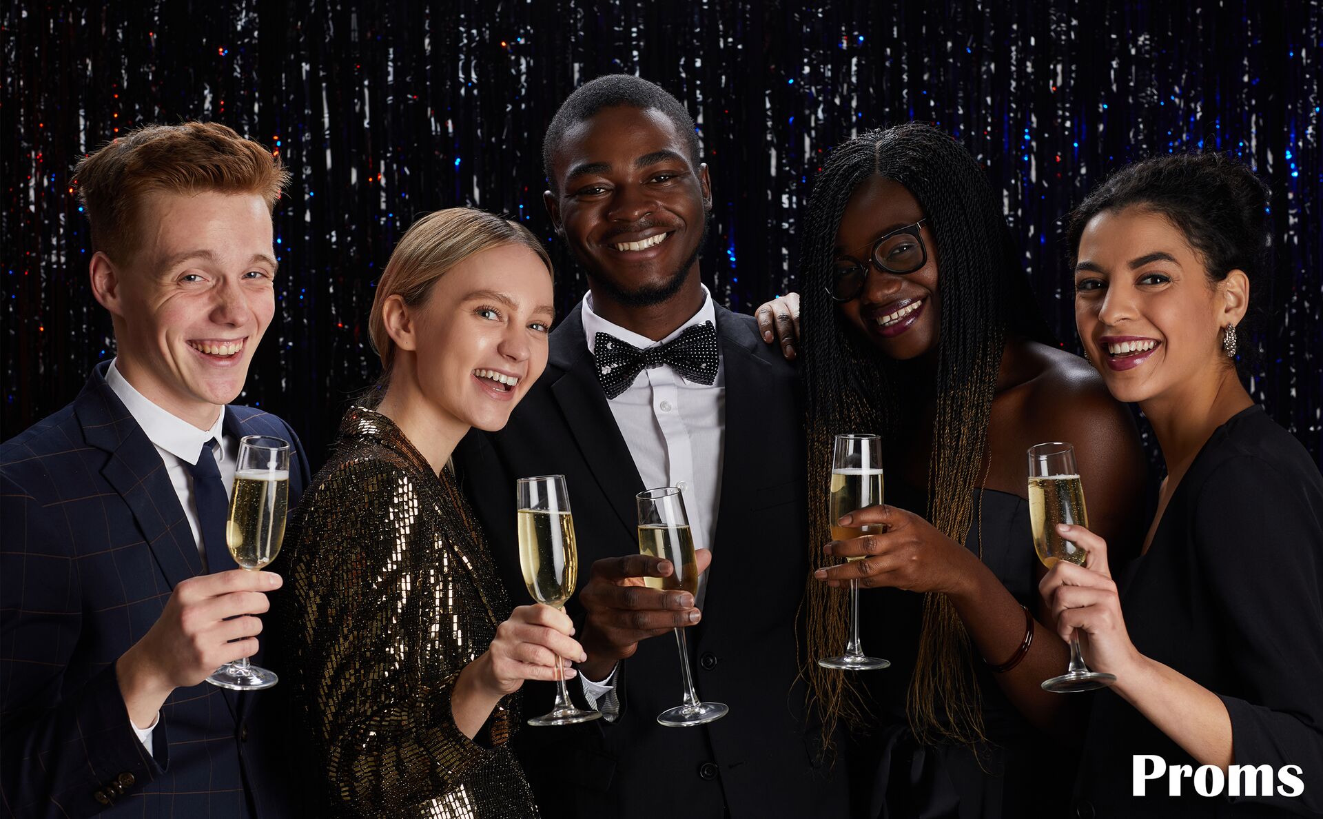 Group of friends at prom in tuxedos